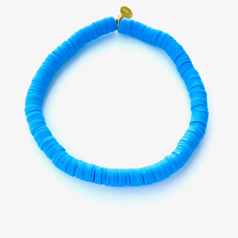 Rubber paillette Confetti Bracelet in blue punch. Bracelet stretches to fit all sizes.