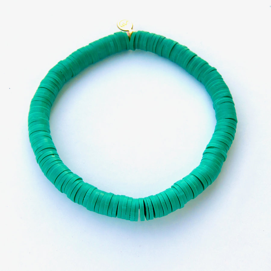 Rubber paillette Confetti Bracelet in emerald green. Bracelet stretches to fit all sizes.