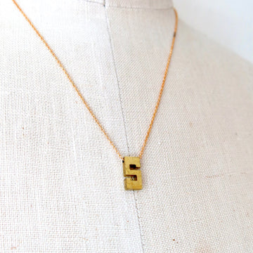 Initial Impressions Necklace by MoonRox Jewellery & Accessories is a monogram pendant floating on fine brass chain.