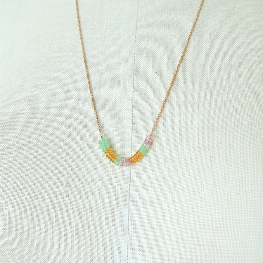 Inner Circle Necklace features a fine brass chain with a carefully arranged series of little colourful glass loops that float along the chain. Made in Toronto, Canada by MoonRox Jewellery & Accessories.