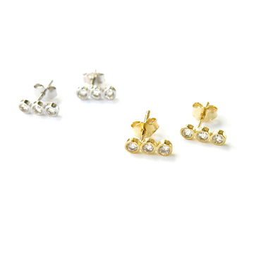 Pebble Stud Earrings feature a row of cubic zirconia stones set in sterling silver or gold plated sterling silver.