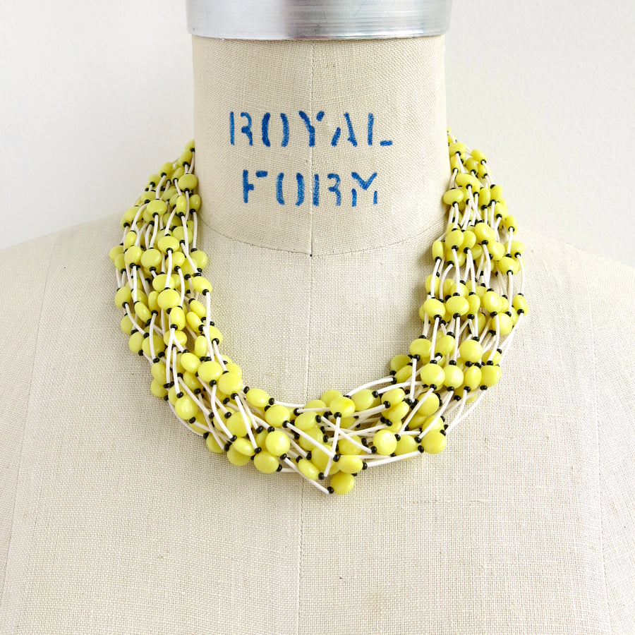 Colourful vintage Tropical Necklace in Lemon colour. This 20 strand statement necklace is lightweight with big impact.  