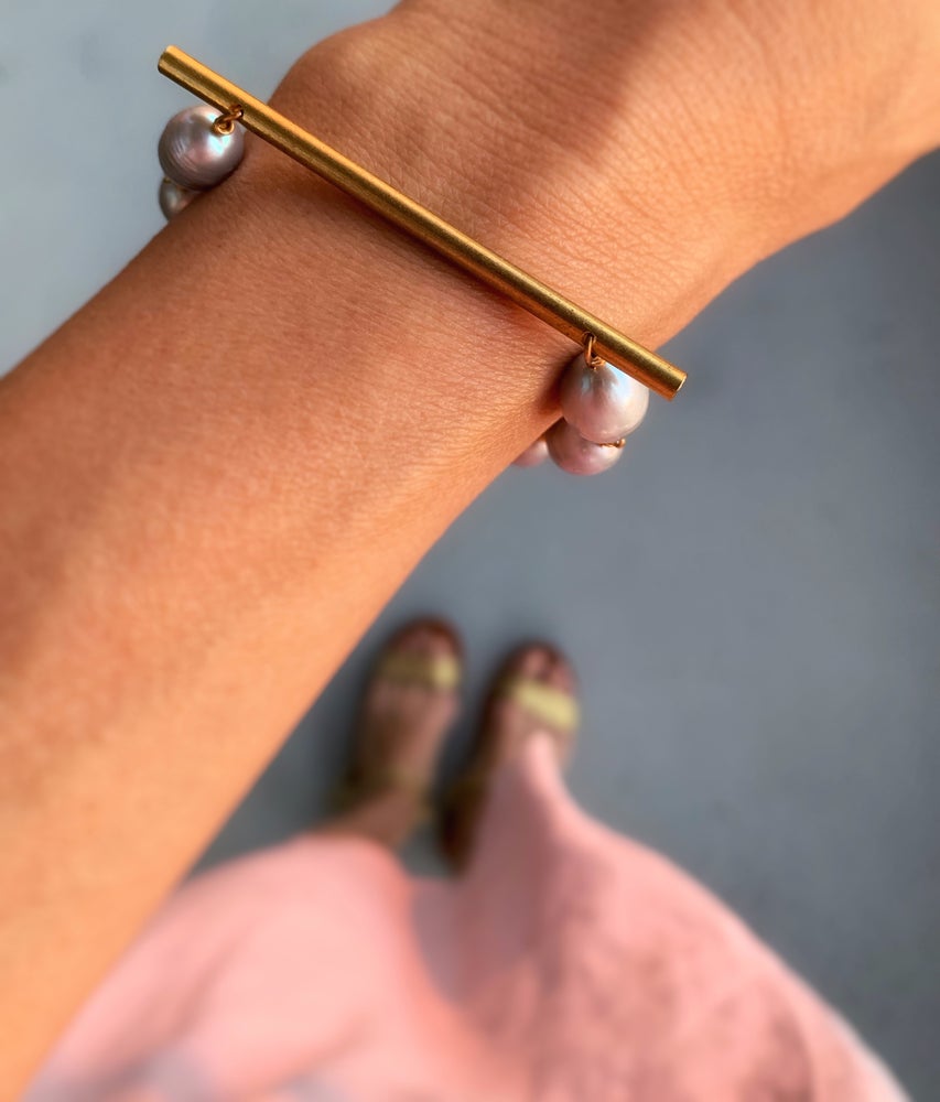 Raise the Bar Bracelet by MoonRox Jewellery & Accessories - Freshwater pearls in organic shapes are hand wired to a sleek brass bar. Pictured on wrist.