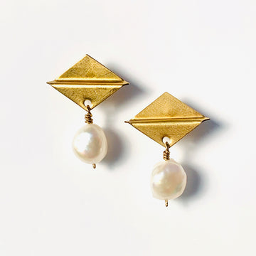 Clio Stud Earrings feature a brass diamond shaped stud with freshwater pearl charms.