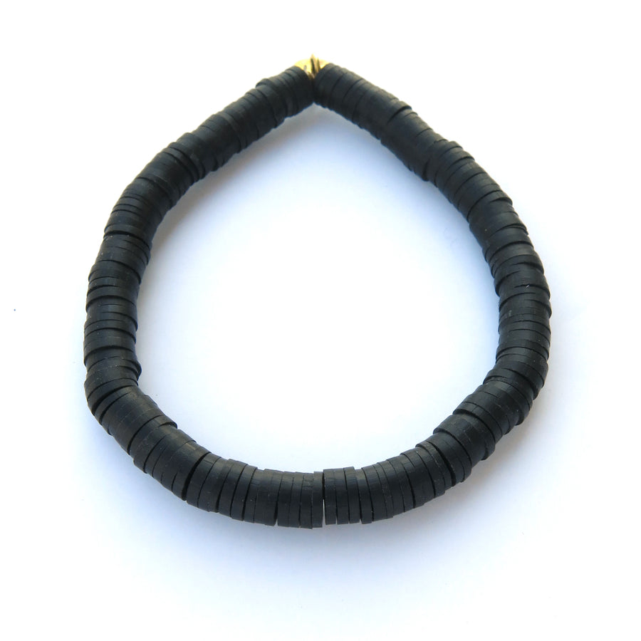 Rubber paillette Confetti Bracelet in black. Bracelet stretches to fit all sizes.