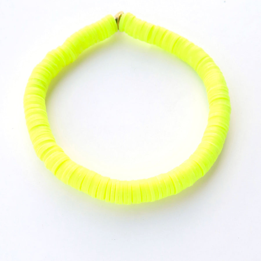 Neon yellow rubber paillette Confetti Bracelet. Bracelet stretches to fit all sizes.
