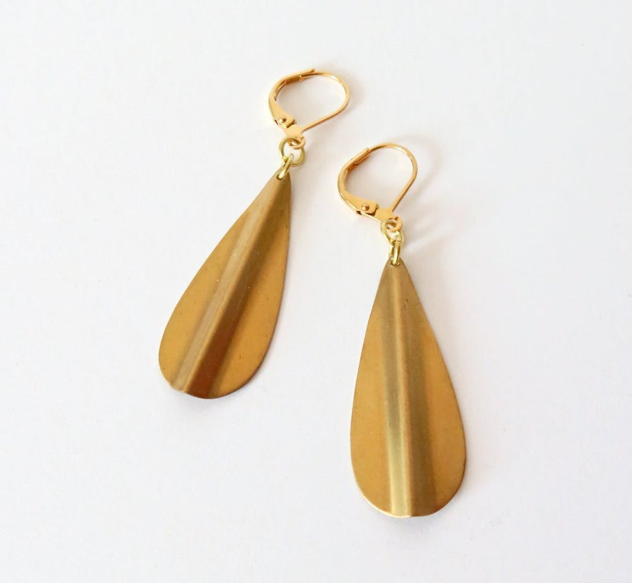 Ridge Earrings feature brass drop shaped charms with a raised ridge down the centre.