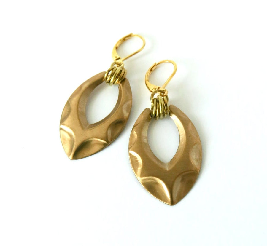 Shadow Earrings by MoonRox are dangly brass charm earrings with raised pattern and multiple loops hung from lever-back ear wires.
