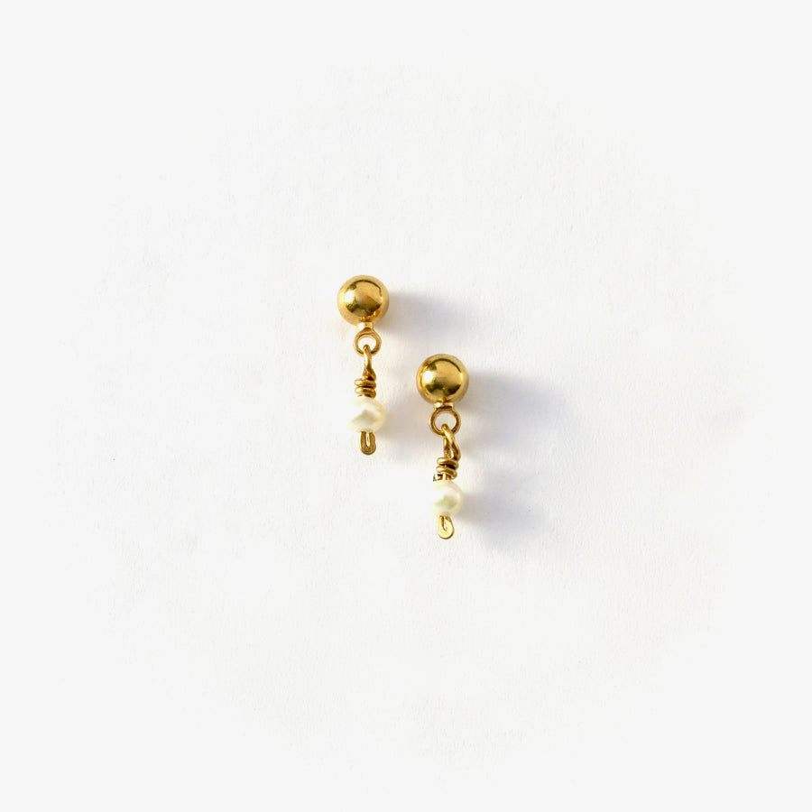 Illuminated Tiny Stud Earrings are little earrings with brass ball stud and a tiny freshwater pearl.