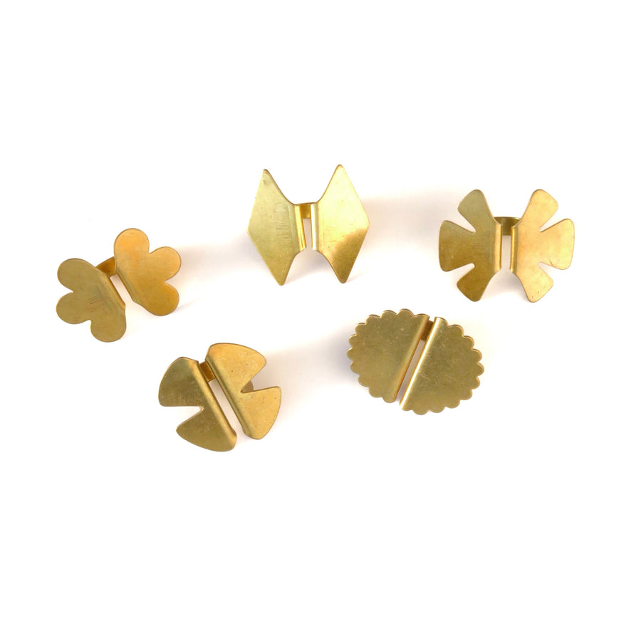 The Monarch Rings are vintage brass rings that are bold, shapely, geometric forms. Size is adjustable. Choose from 5 styles, each available in limited quantities.