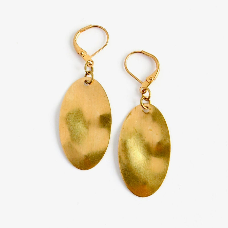 On the Same Wavelength Earrings by MoonRox Jewellery & Accessories feature oval brass charms with undulating surface.