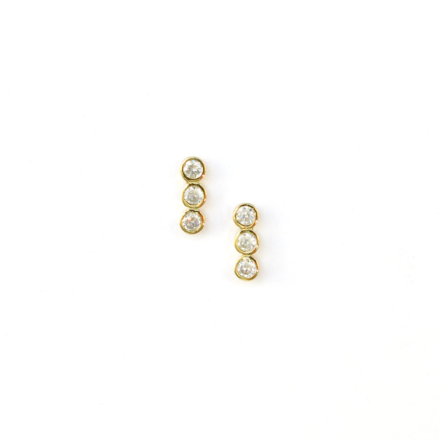 Pebble Stud Earrings feature a row of cubic zirconia stones shown in gold plated sterling silver.