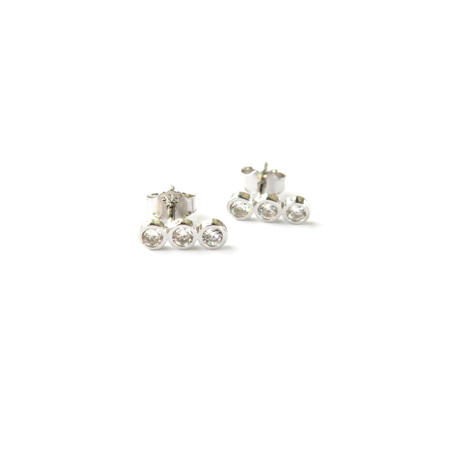 Pebble Stud Earrings feature a row of three cubic zirconia stones set in sterling silver.