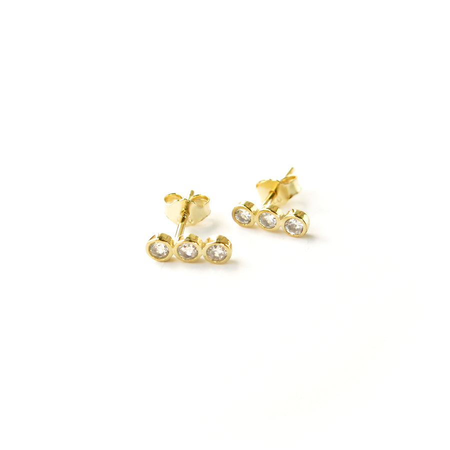 Pebble Stud Earrings feature a row of cubic zirconia stones set in gold plated sterling silver.