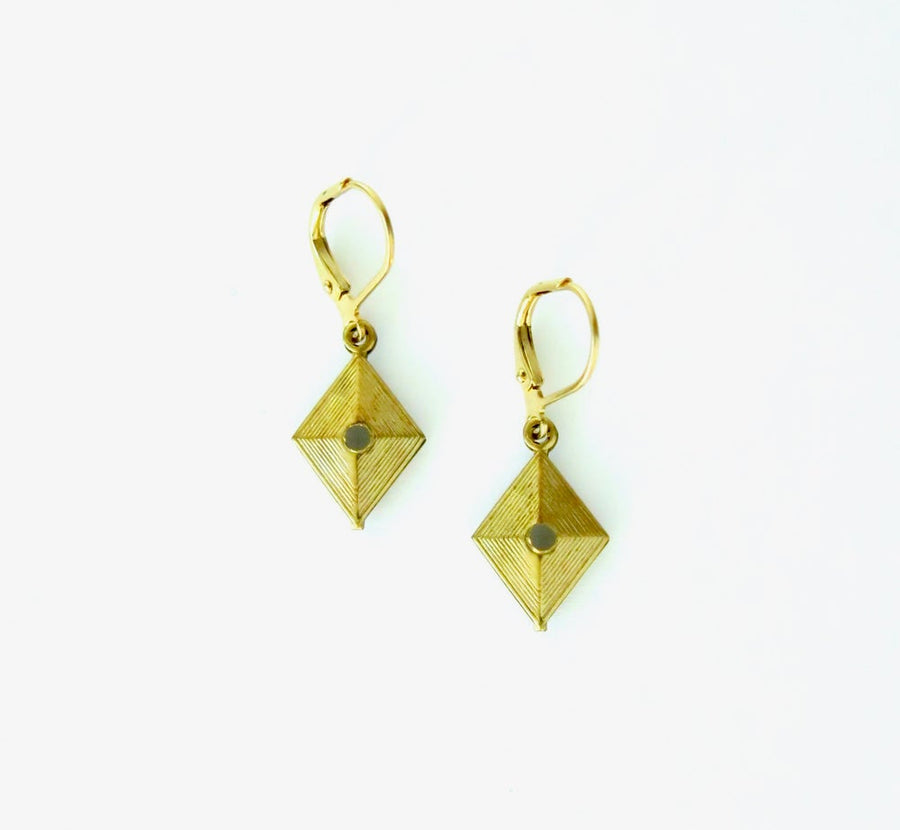 Pivot Earrings are small brass earrings with 4 sides charms.
