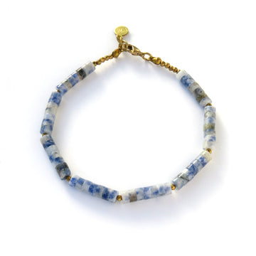 Polished Bracelets feature a combination of smooth round disc shaped beads in blue aventurine and faceted coated hematite accents. 