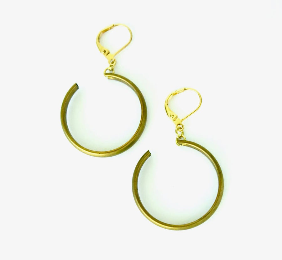 Ringlet Earrings feature a curl of brass that winds from front to back