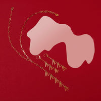 Rising Phoenix Lariat and Earrings with brass fringe charms.