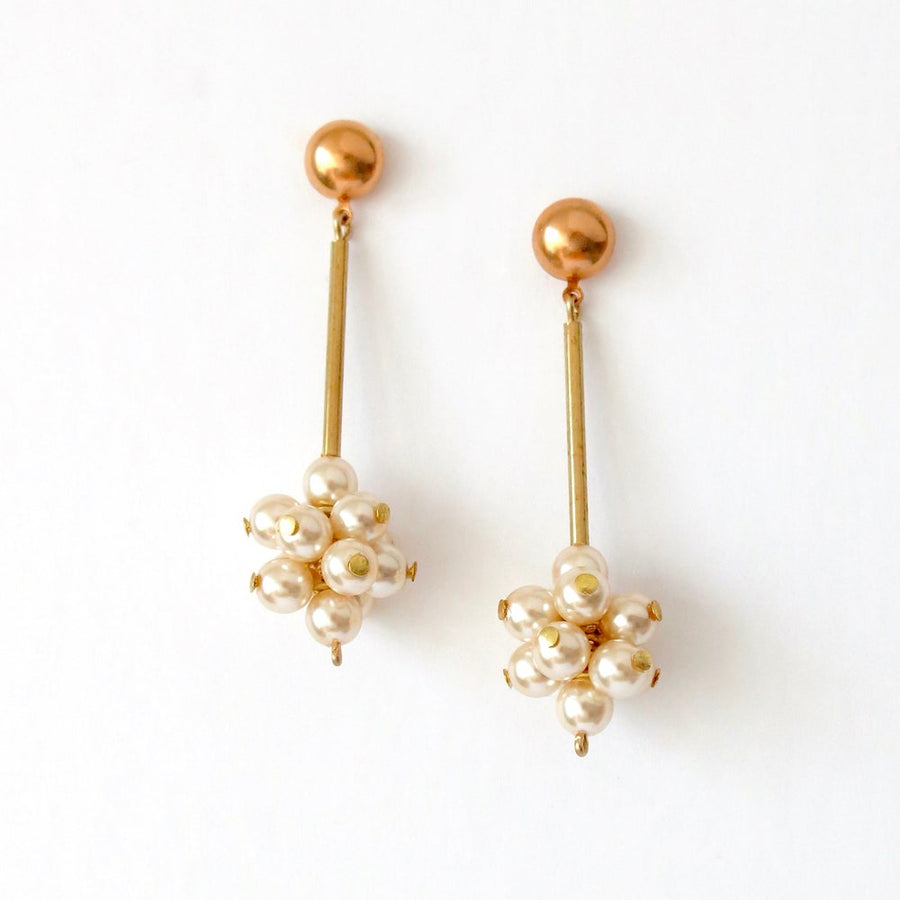 Sanibel Belle Stud Earrings with clusters of glass pearls sitting below brass rods. Made in Toronto, Canada.