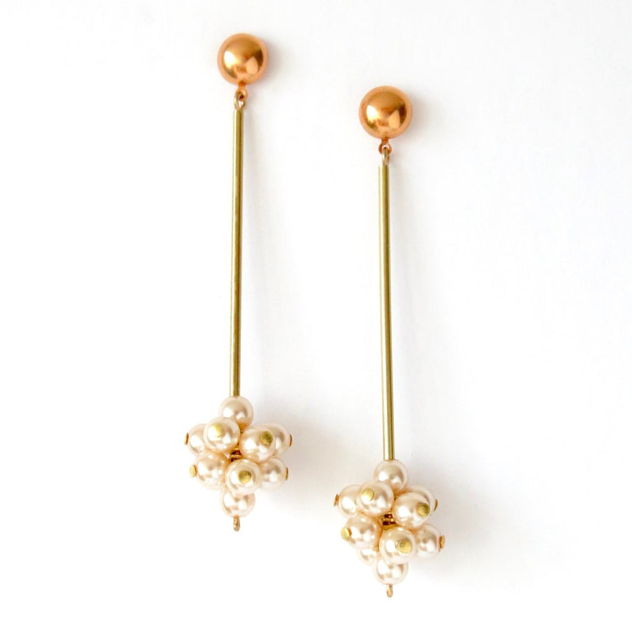 Sanibel Belle Stud Earrings with clusters of glass pearls sitting below brass rods.