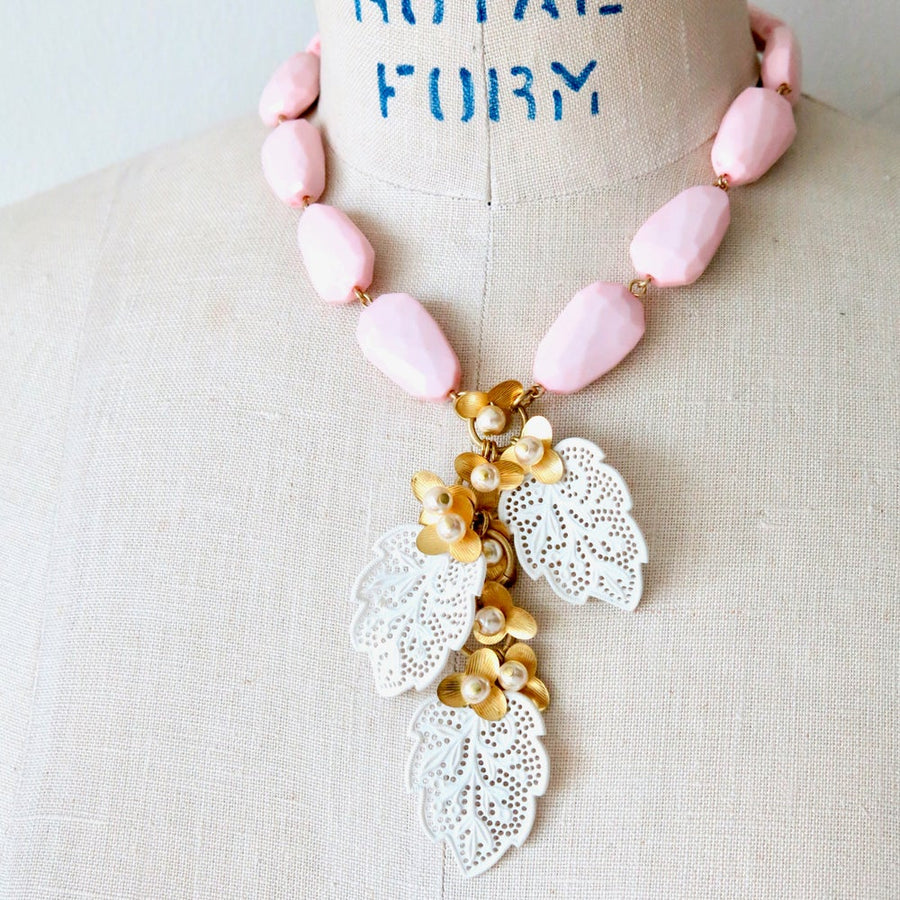 Secret Garden Necklace by MoonRox Jewellery & Accessories - This necklace is made of vintage faceted pink beads with cascading brass and pearl flowers with delicate vintage celluloid lace leaves.