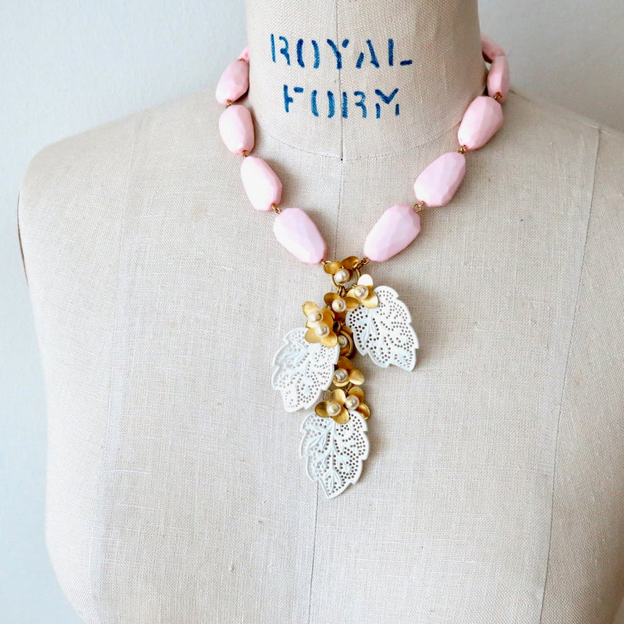 Secret Garden Necklace by MoonRox Jewellery & Accessories - This necklace is made of vintage faceted pink beads with cascading brass and pearl flowers with delicate vintage celluloid lace leaves. 