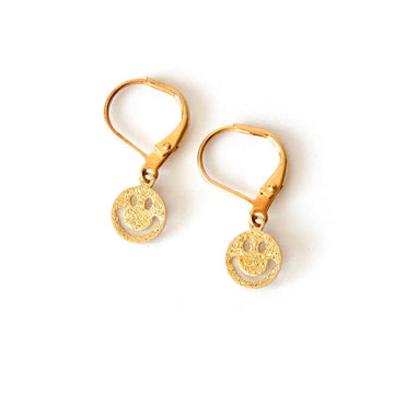 Smiley Earrings by MoonRox are shimmery brass happy faces hanging from lever back and nickel-free ear wires.