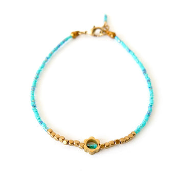 Surfside Bracelet by MoonRox - Dainty bracelet with turquoise beads with brass flower centrepiece.