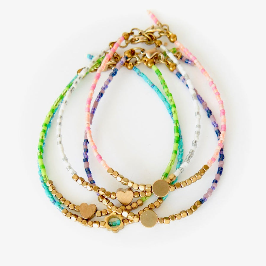 Surfside Bracelet by MoonRox Jewellery & Accessories - Dainty bracelets with brass centrepieces. Choose either a Circle, Heart or Flower to sit at the centre. Each is available in five cheerful colours.