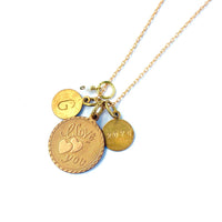 Token Necklace by MoonRox - Charm necklace with assorted coin shaped charms including one that says 