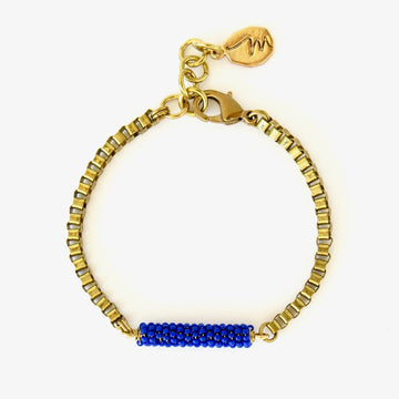 Wonder Bracelet by MoonRox Jewellery & Accessories showcases hand beaded centre piece with brass box chain. Shown in Cobalt Blue colour.