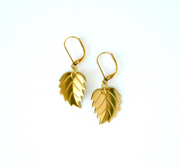 Leaf Earrings by MoonRox Jewellery & Accessories feature serrated brass leaves hung from lever back ear wires.