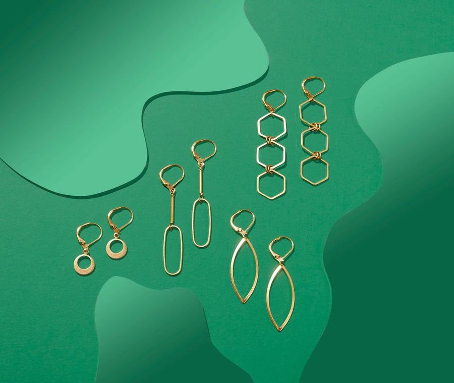 Melody Earrings with oblong charms hand wired below brass rods. Shown in Lookbook with Sonic, Aria and Encore Earrings. 